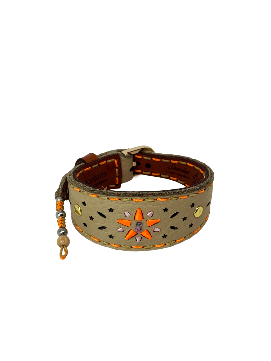Decorative leather bracelet with star and bead embellishments on a white background
Details